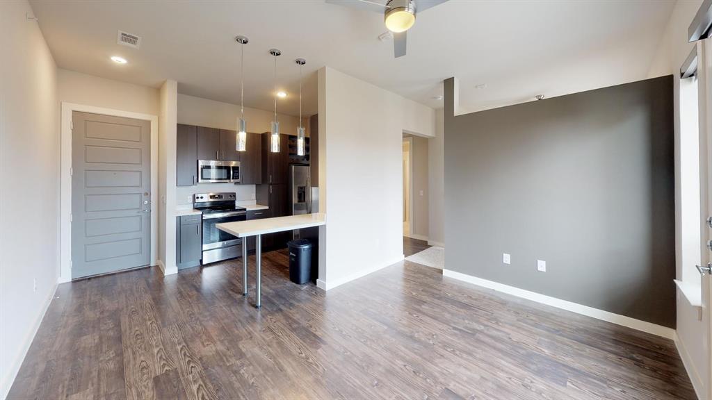 1500 North Haskell Avenue, Unit 1000 Dallas, TX 75204 - Photo 2 of 7 a view of kitchen with cabinets and wooden floor