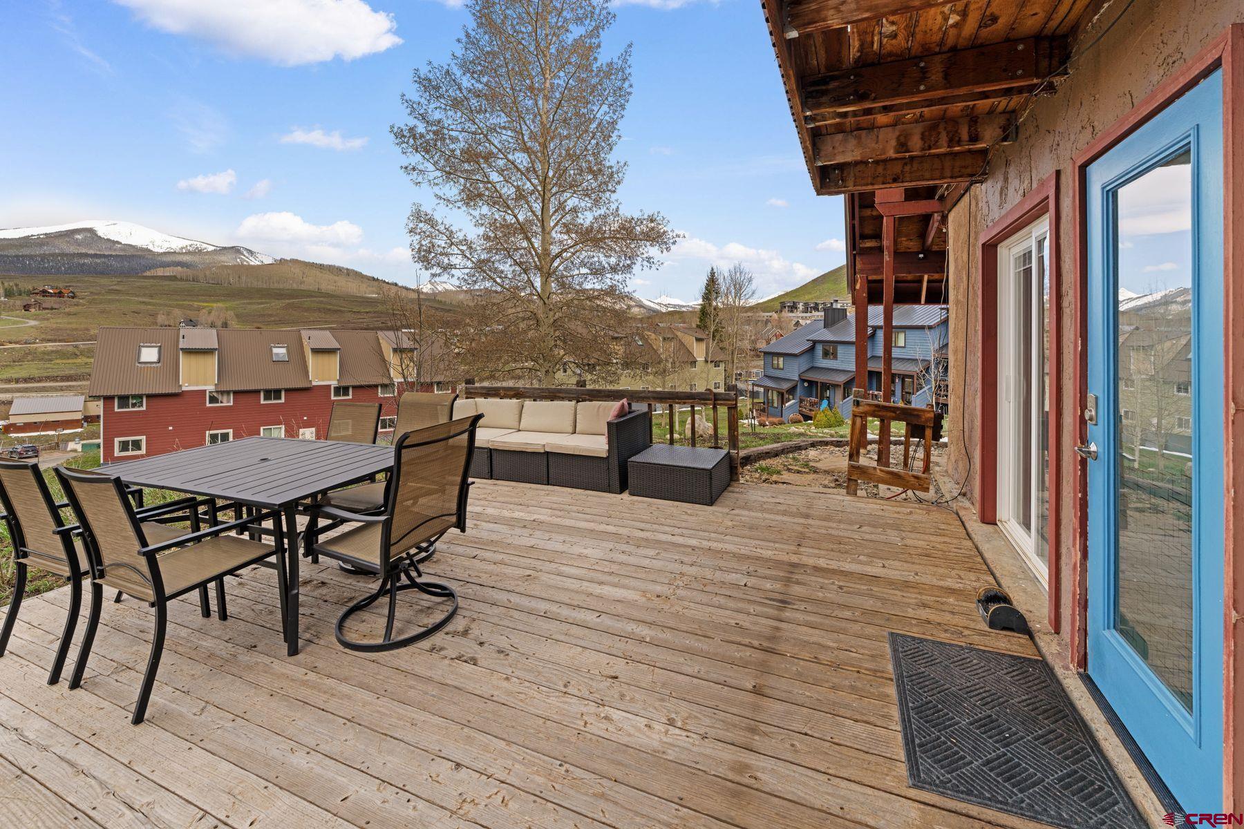 31 Castle Road, Unit 1 Crested Butte, CO 81225 - Photo 24 of 34 a view of a terrace with furniture and stove