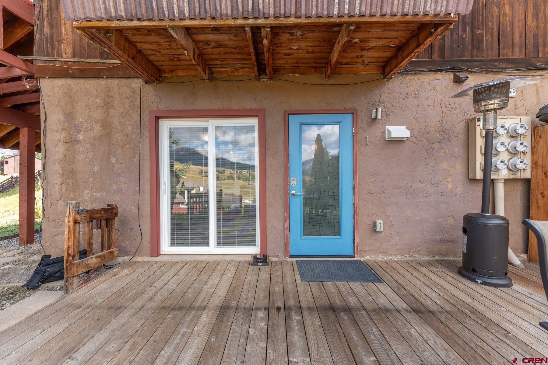 31 Castle Road, Unit 1 Crested Butte, CO 81225 - Photo 25 of 34 a view of a patio with table and chairs