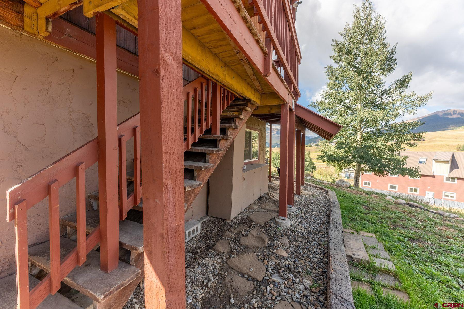 31 Castle Road, Unit 1 Crested Butte, CO 81225 - Photo 26 of 34 a view of a house with backyard and deck