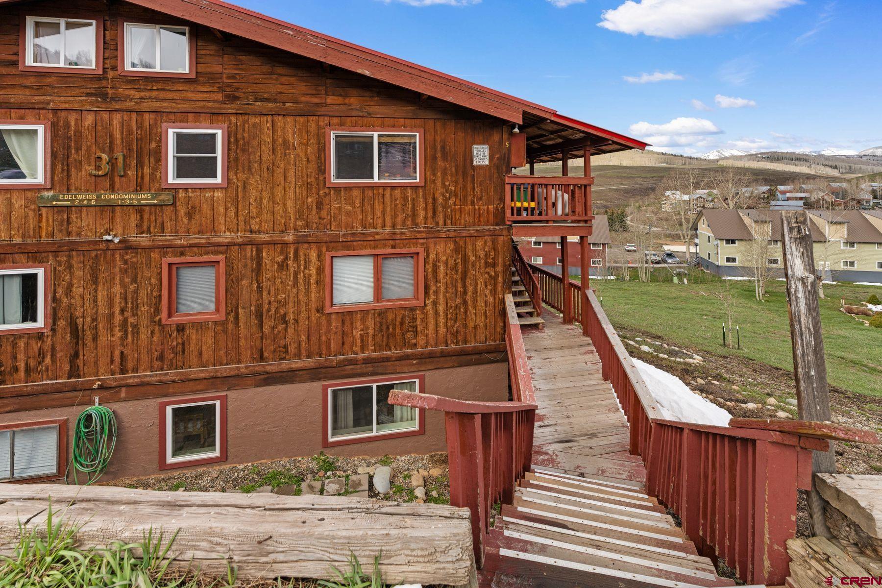 31 Castle Road, Unit 1 Crested Butte, CO 81225 - Photo 27 of 34 a view of a house with a yard