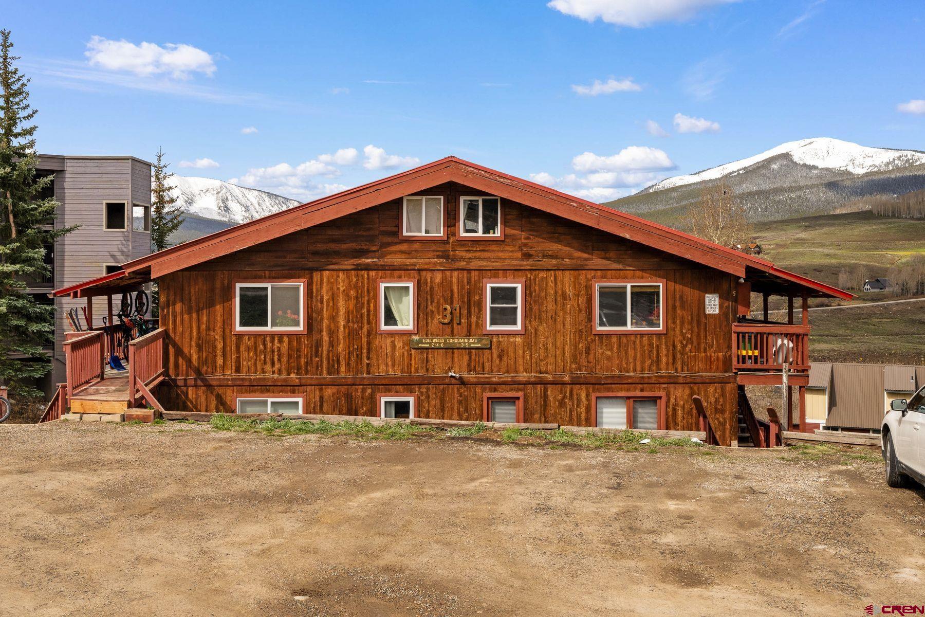 31 Castle Road, Unit 1 Crested Butte, CO 81225 - Photo 28 of 34 a view of a house with wooden fence
