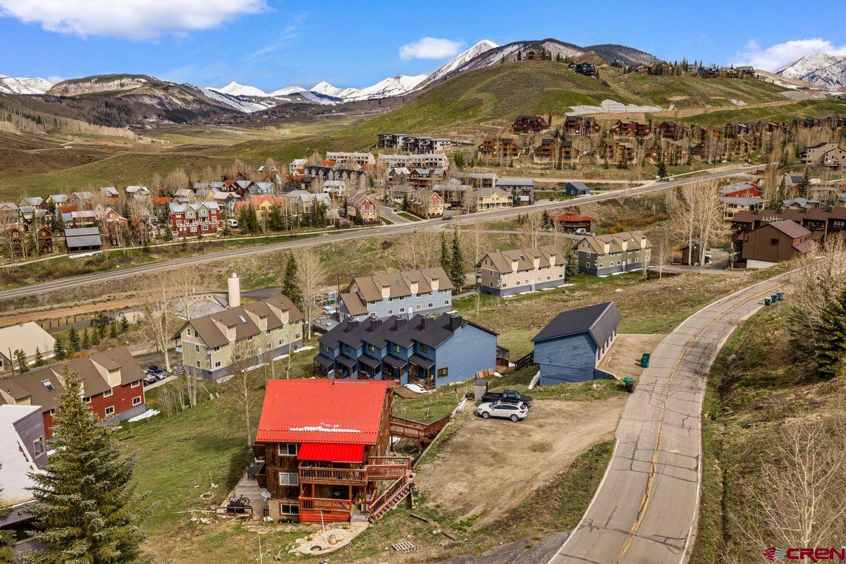 31 Castle Road, Unit 1 Crested Butte, CO 81225 - Photo 33 of 34 an aerial view of a city with lots of residential buildings ocean and mountain view in back