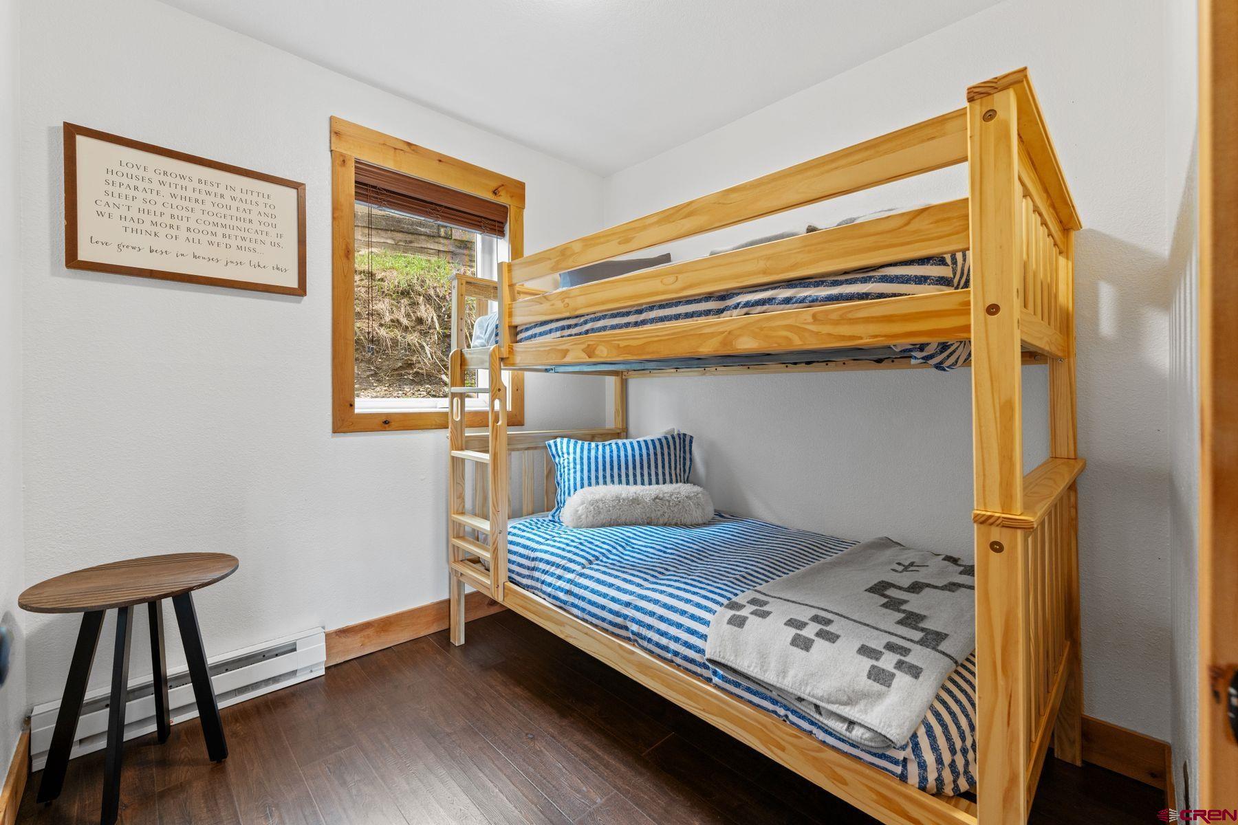 31 Castle Road, Unit 1 Crested Butte, CO 81225 - Photo 6 of 34 a bedroom with a bed and a window