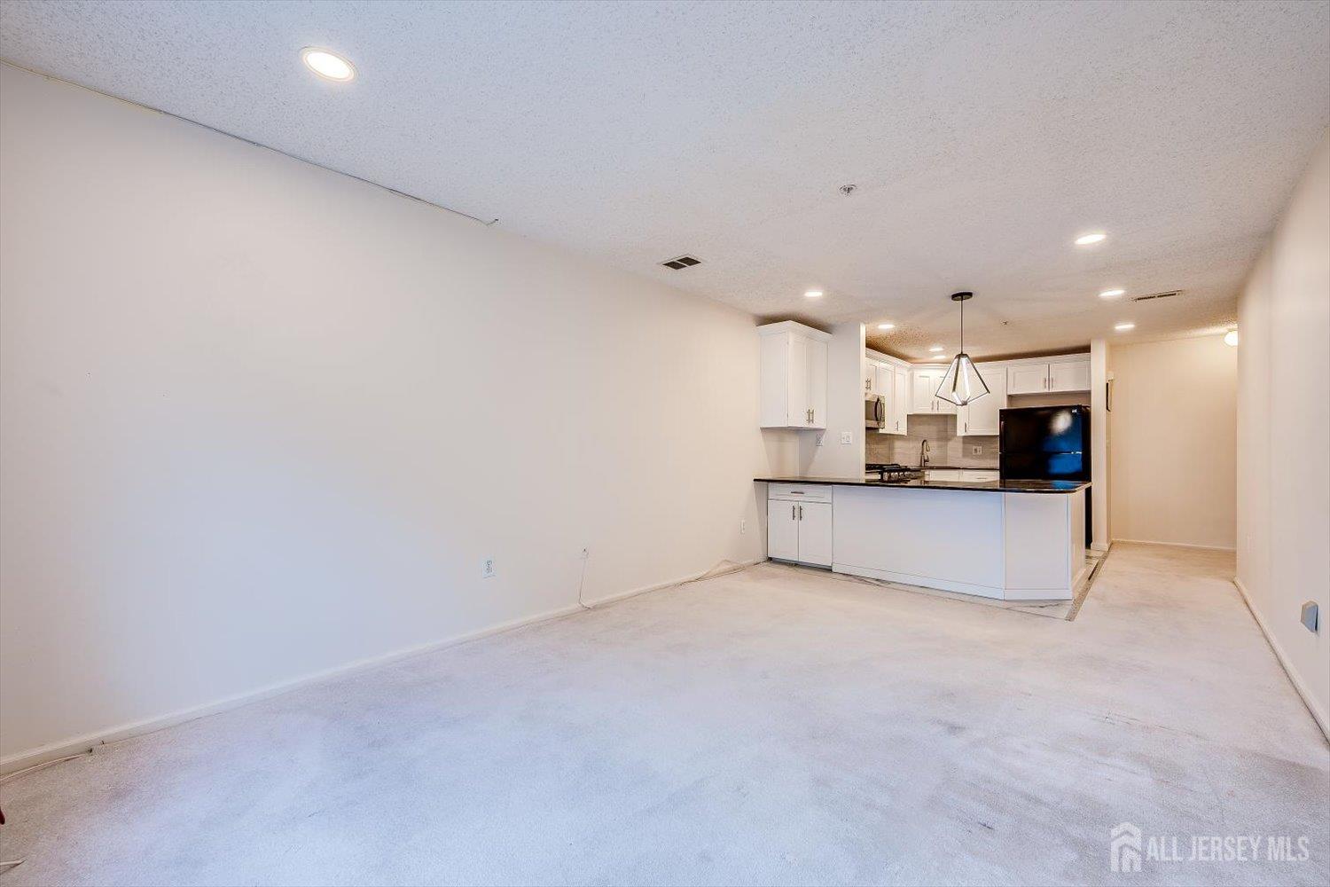 10 Guisborough Way Edison, NJ 08820 - Photo 12 of 27 a view of kitchen and a refrigerator