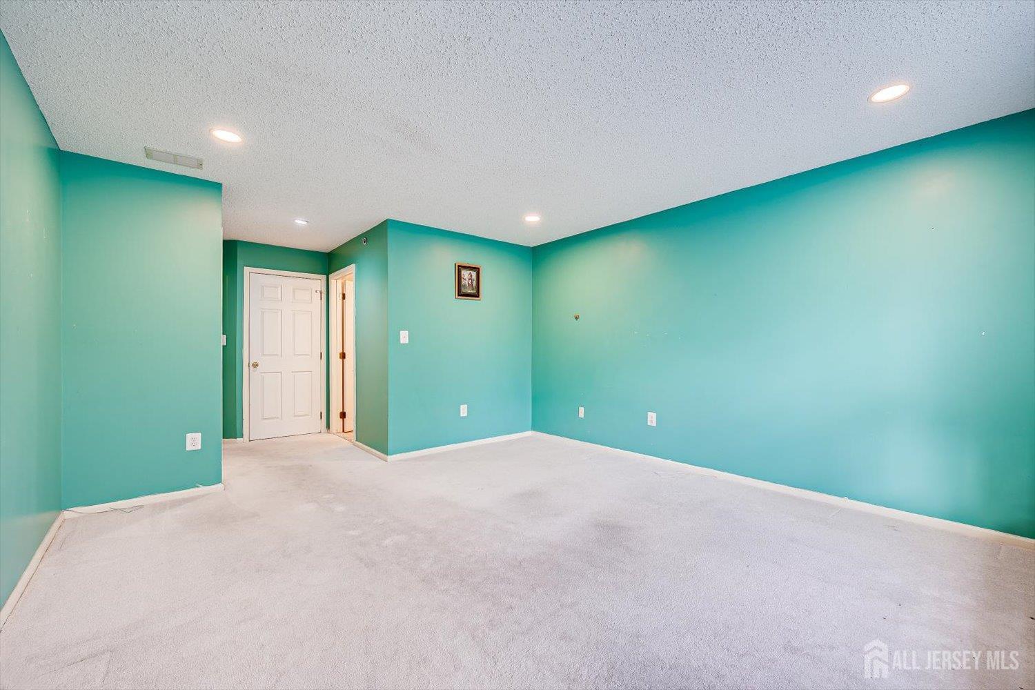 10 Guisborough Way Edison, NJ 08820 - Photo 17 of 27 a view of a big room with wooden floor