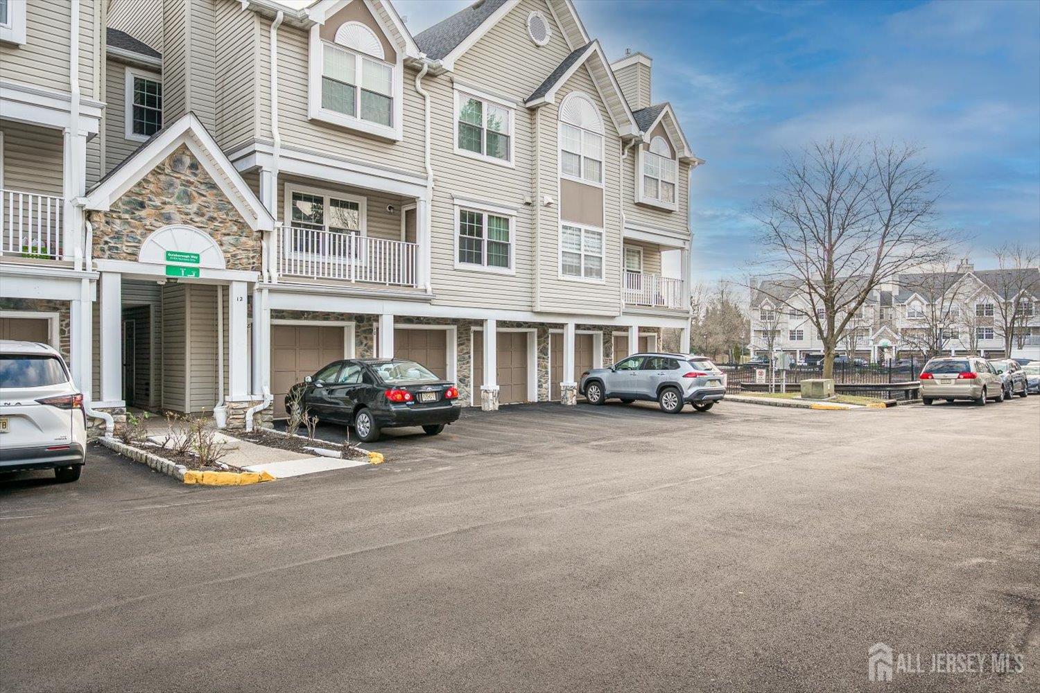 10 Guisborough Way Edison, NJ 08820 - Photo 2 of 27 a view of a street with cars