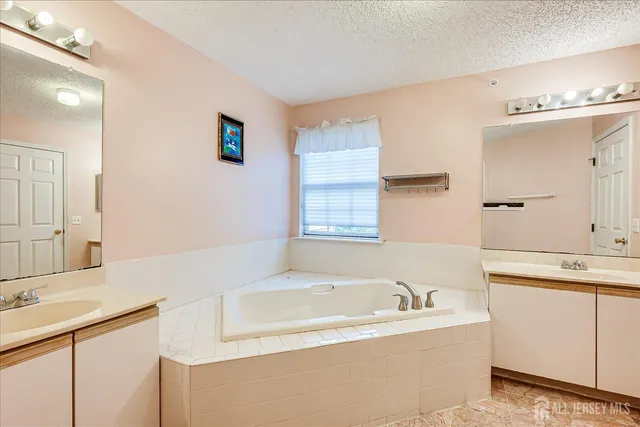 a bathroom with a toilet a sink and shower