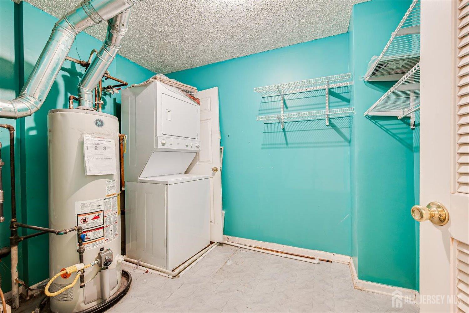 10 Guisborough Way Edison, NJ 08820 - Photo 27 of 27 a utility room with dryer and washer