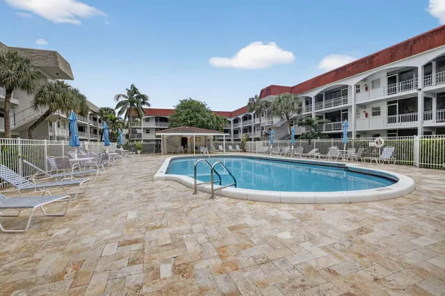 a view of a swimming pool with a terrace