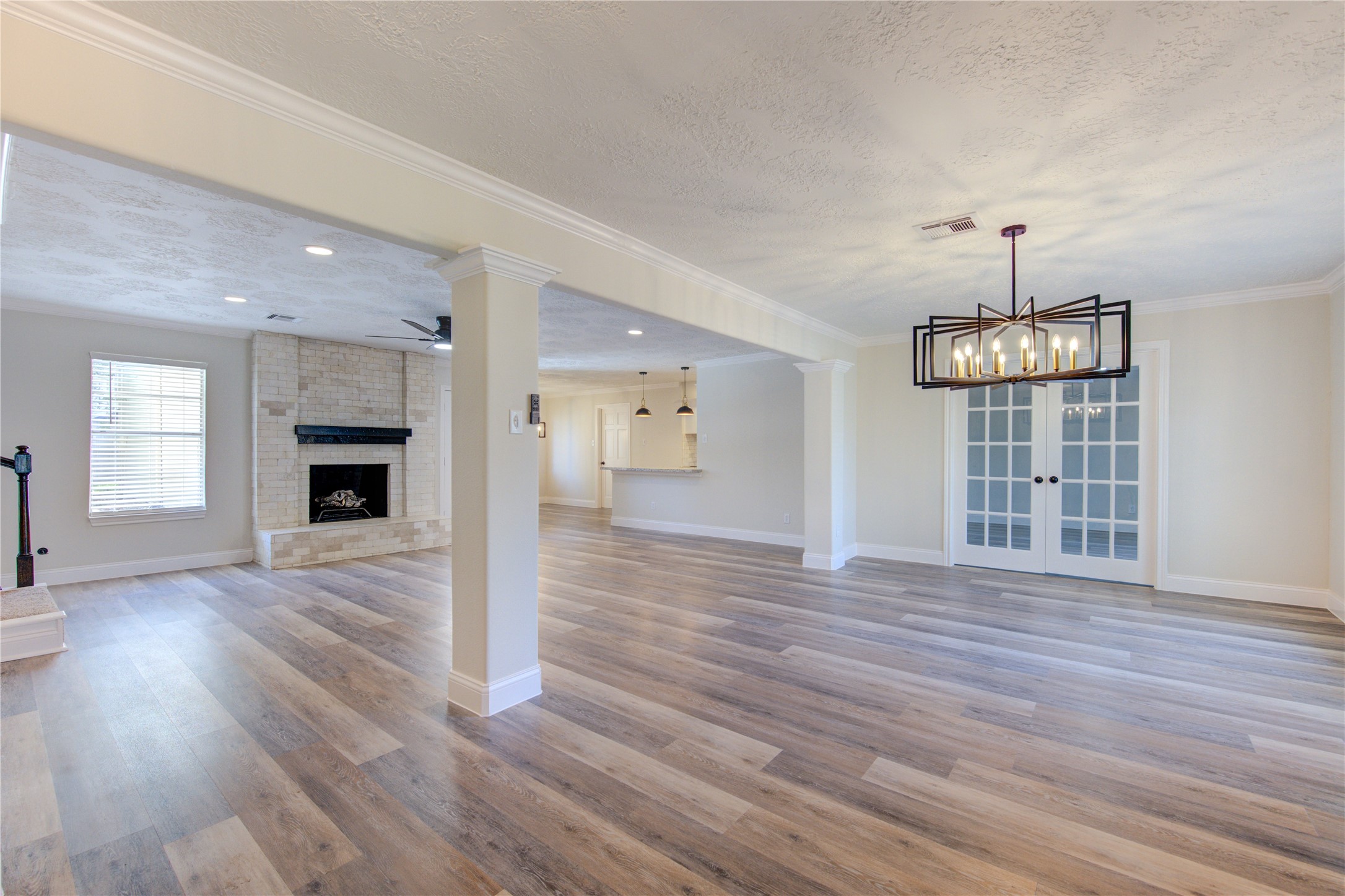 9115 Taidswood Drive Spring, TX 77379 - Photo 5 of 45 The moment you enter you will notice all of the updates throughout, along with several walls removed to create an open living concept. Home has been freshly painted inside and out, all new flooring downstairs, and stylish chandeliers and light fixtures installed.