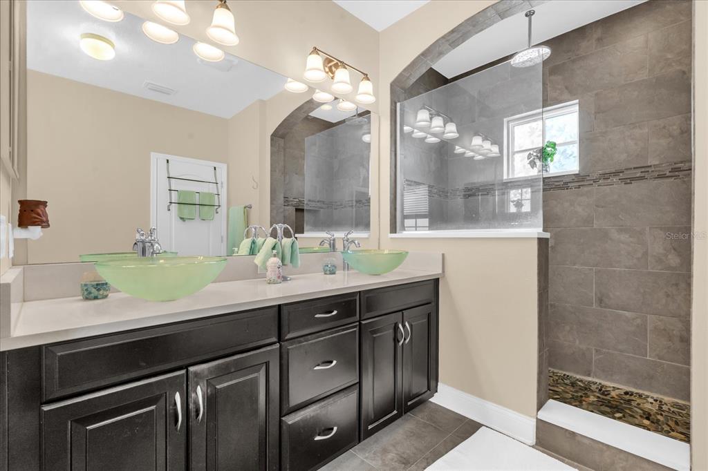 1547 Resolute Street Celebration, FL 34747 - Photo 19 of 40 a bathroom with a double vanity sink mirror and double