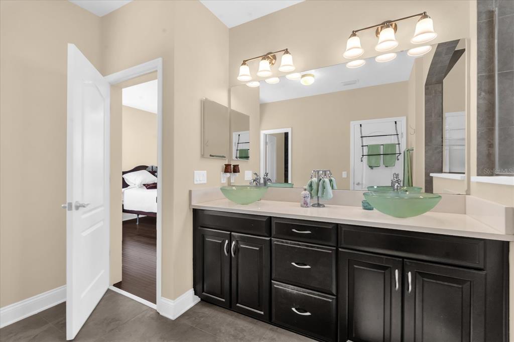 1547 Resolute Street Celebration, FL 34747 - Photo 20 of 40 a bathroom with a sink and a mirror