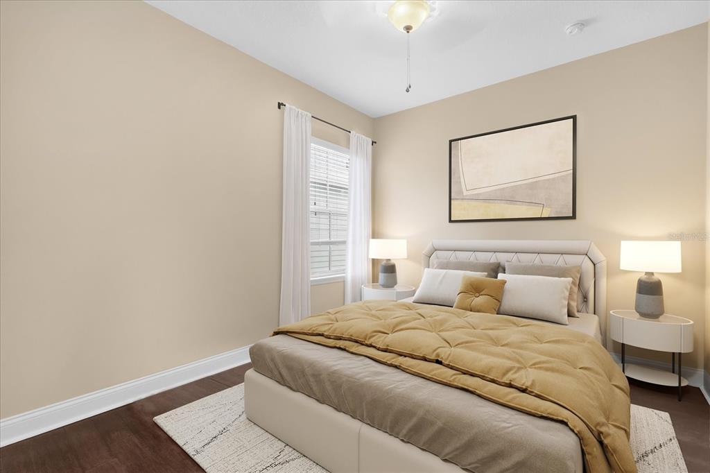 1547 Resolute Street Celebration, FL 34747 - Photo 21 of 40 a bedroom with a bed and a painting on the wall