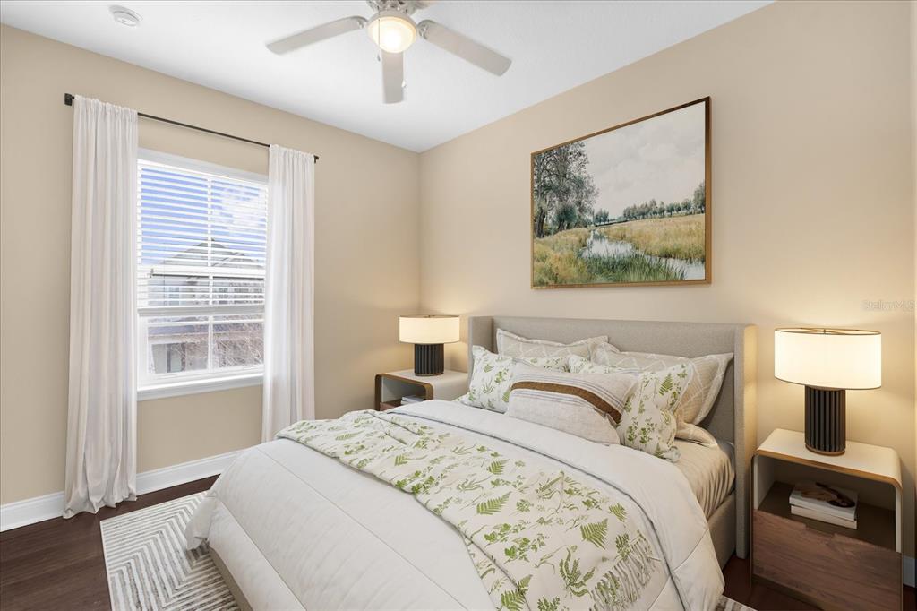 1547 Resolute Street Celebration, FL 34747 - Photo 22 of 40 a bedroom with a bed and a painting on the wall