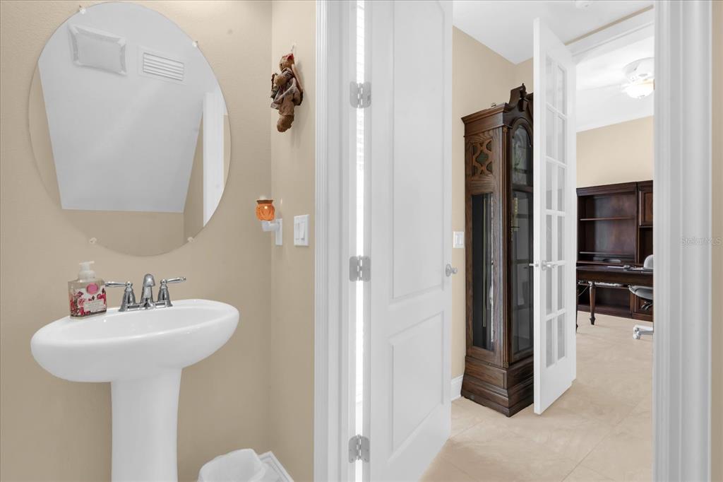 1547 Resolute Street Celebration, FL 34747 - Photo 25 of 40 a bathroom with a sink and a mirror