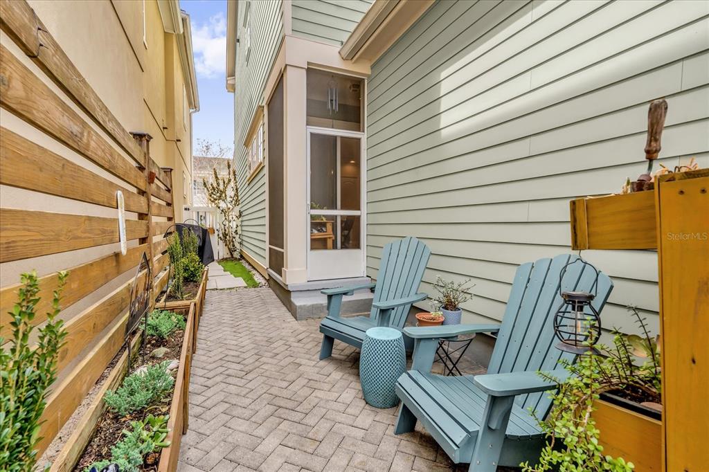 1547 Resolute Street Celebration, FL 34747 - Photo 26 of 40 a view of an outdoor sitting area with brick walls
