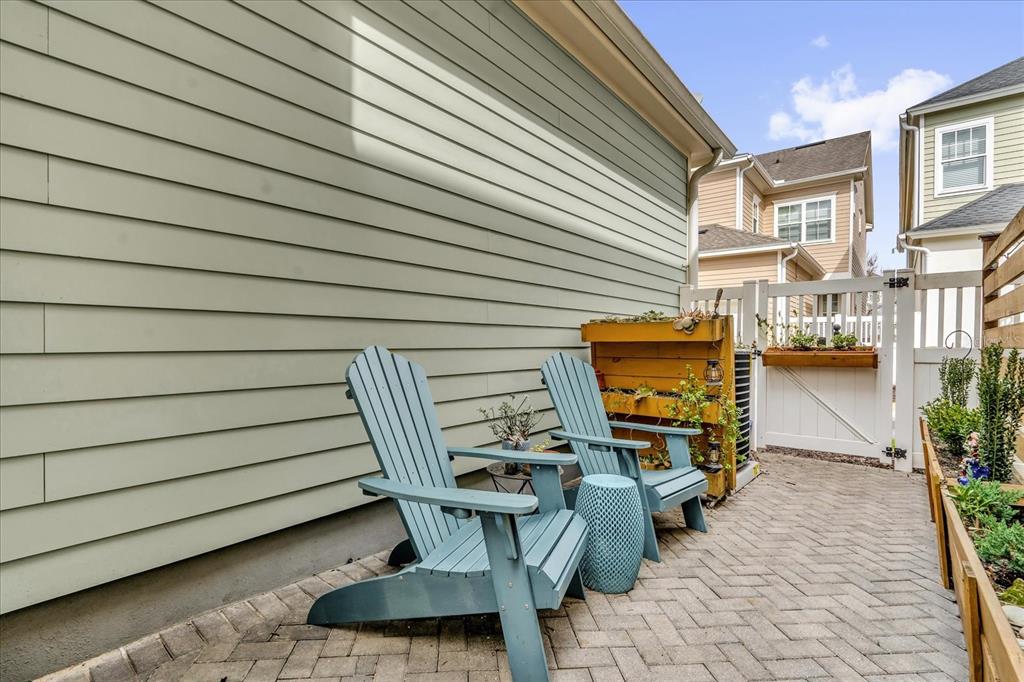 1547 Resolute Street Celebration, FL 34747 - Photo 27 of 40 a view of a patio with chair and tables