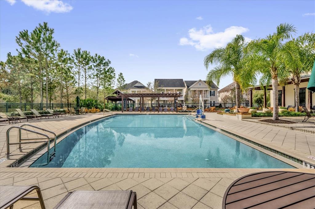 1547 Resolute Street Celebration, FL 34747 - Photo 31 of 40 a view of swimming pool with outdoor seating and plants