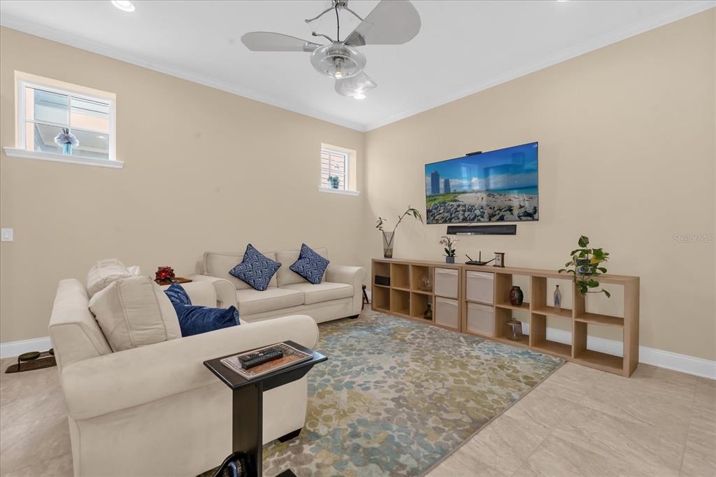 1547 Resolute Street Celebration, FL 34747 - Photo 7 of 40 a living room with furniture and a flat screen tv