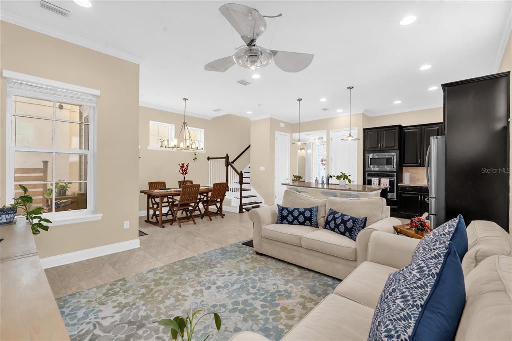 1547 Resolute Street Celebration, FL 34747 - Photo 8 of 40 a living room with furniture and wooden floor