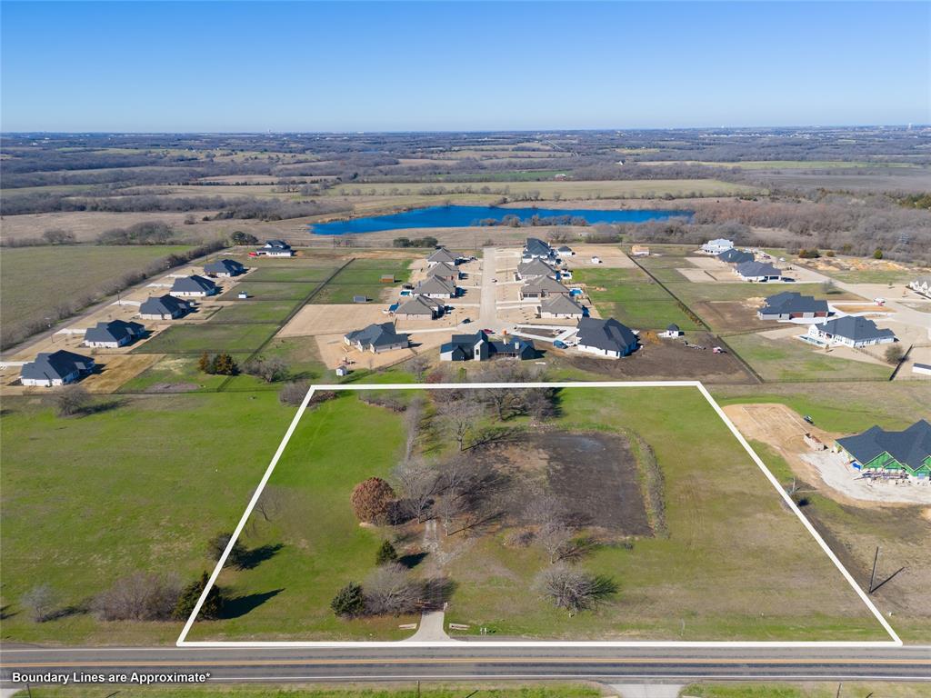 2500 Weston Road Weston, TX 75009 - Photo 2 of 13 Aerial view of residential area featuring a nearby body of water and property boundaries highlighted