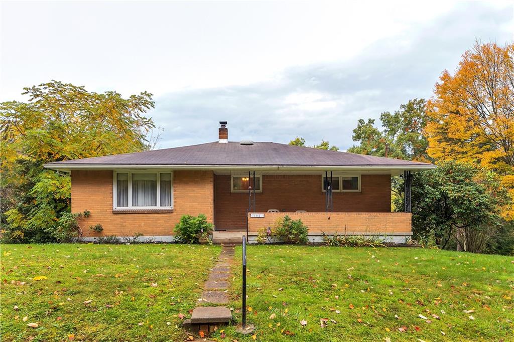 156 Wendel Road Herminie, PA 15637 - Photo 1 of 25 a front view of a house with garden