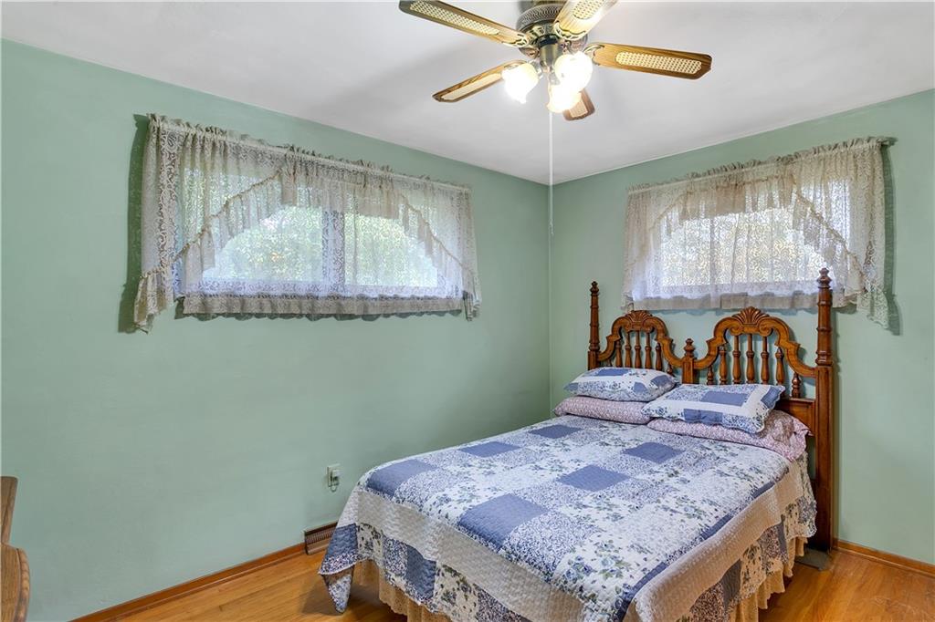 156 Wendel Road Herminie, PA 15637 - Photo 19 of 25 a bedroom with a bed and a chandelier
