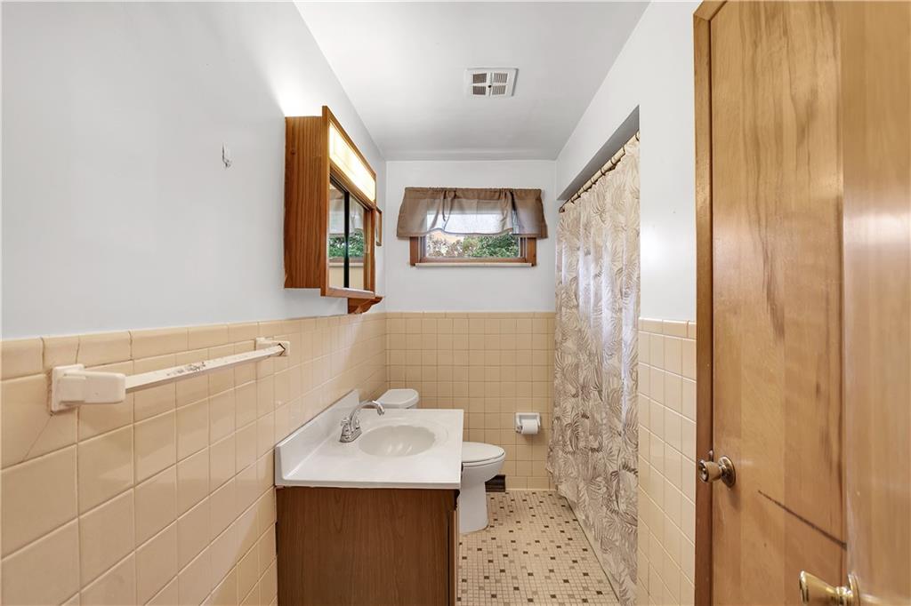 156 Wendel Road Herminie, PA 15637 - Photo 21 of 25 a bathroom with a sink toilet and shower