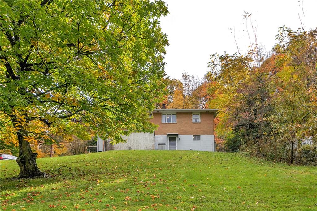 156 Wendel Road Herminie, PA 15637 - Photo 5 of 25 a front view of a house with a yard