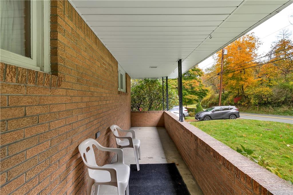 156 Wendel Road Herminie, PA 15637 - Photo 8 of 25 a balcony with chairs and wooden floor