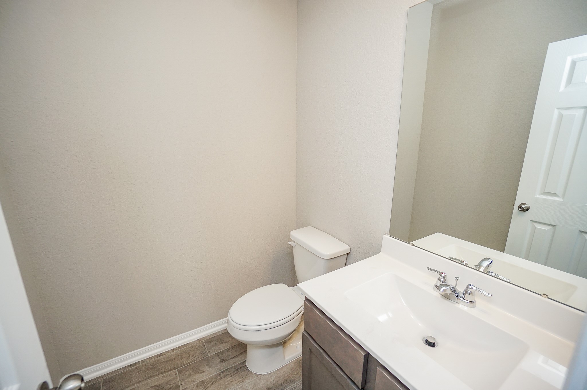 5463 Grand View Drive Fulshear, TX 77423 - Photo 19 of 32 a white toilet sitting next to a white sink