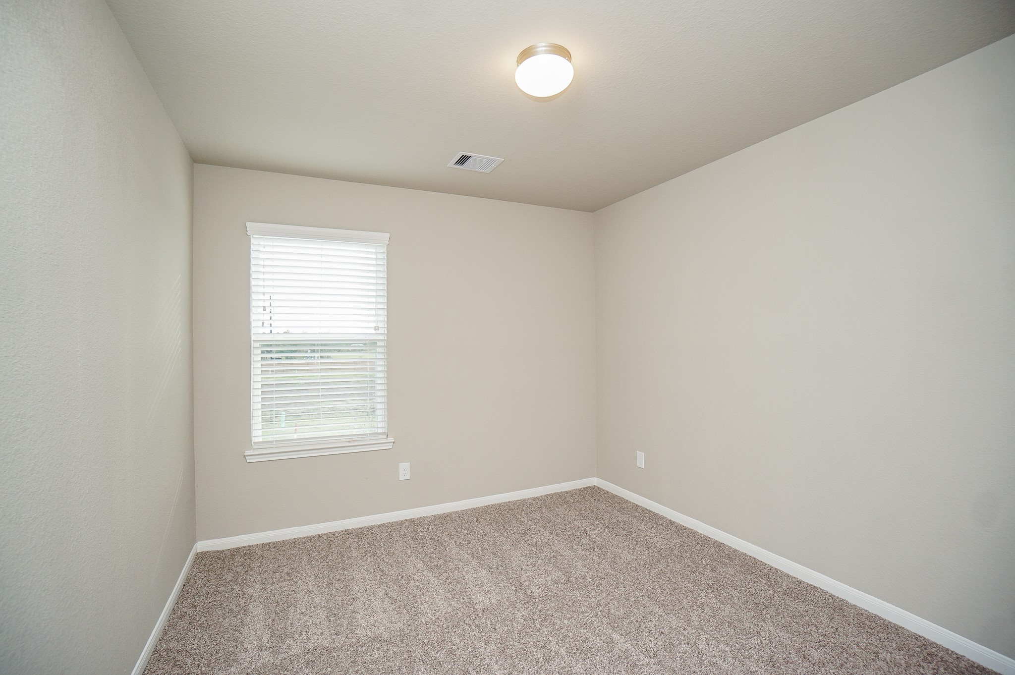 5463 Grand View Drive Fulshear, TX 77423 - Photo 21 of 32 an empty room with a window