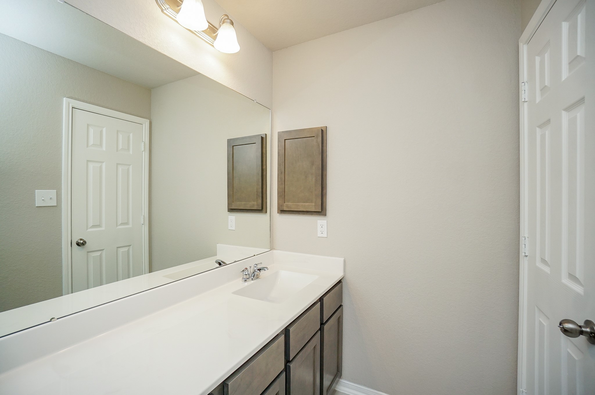 5463 Grand View Drive Fulshear, TX 77423 - Photo 24 of 32 a bathroom with a sink and a mirror