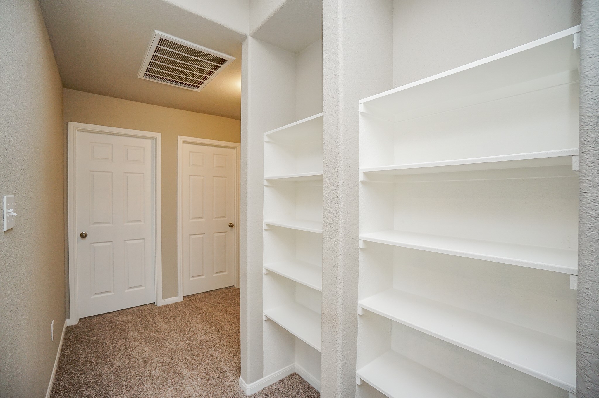 5463 Grand View Drive Fulshear, TX 77423 - Photo 25 of 32 a view of walk in closet with empty racks