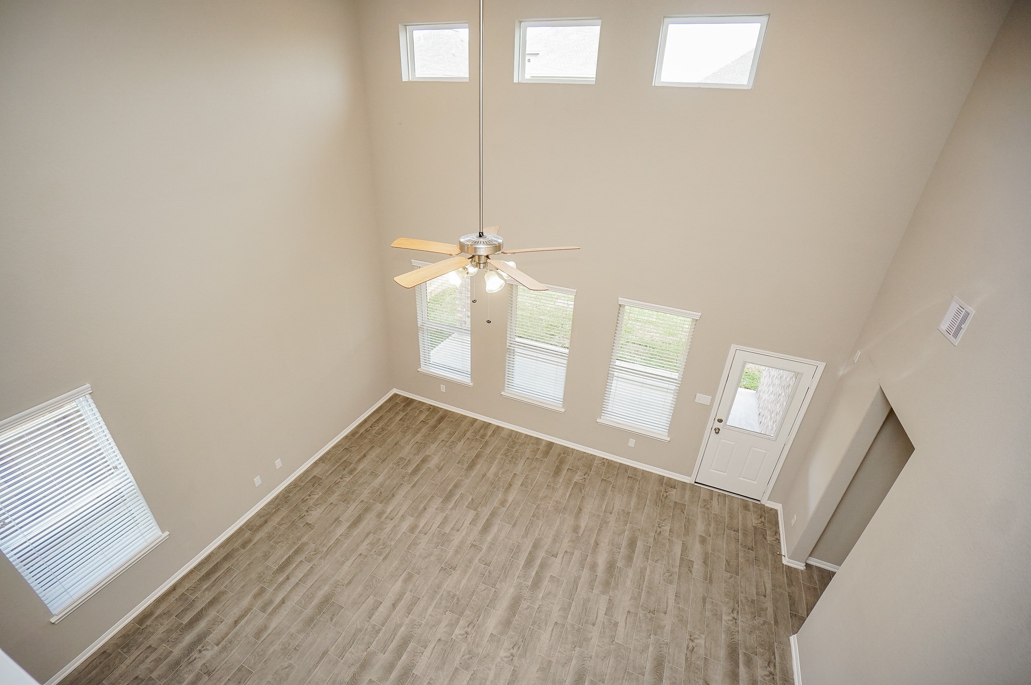 5463 Grand View Drive Fulshear, TX 77423 - Photo 26 of 32 a view of empty room with wooden floor