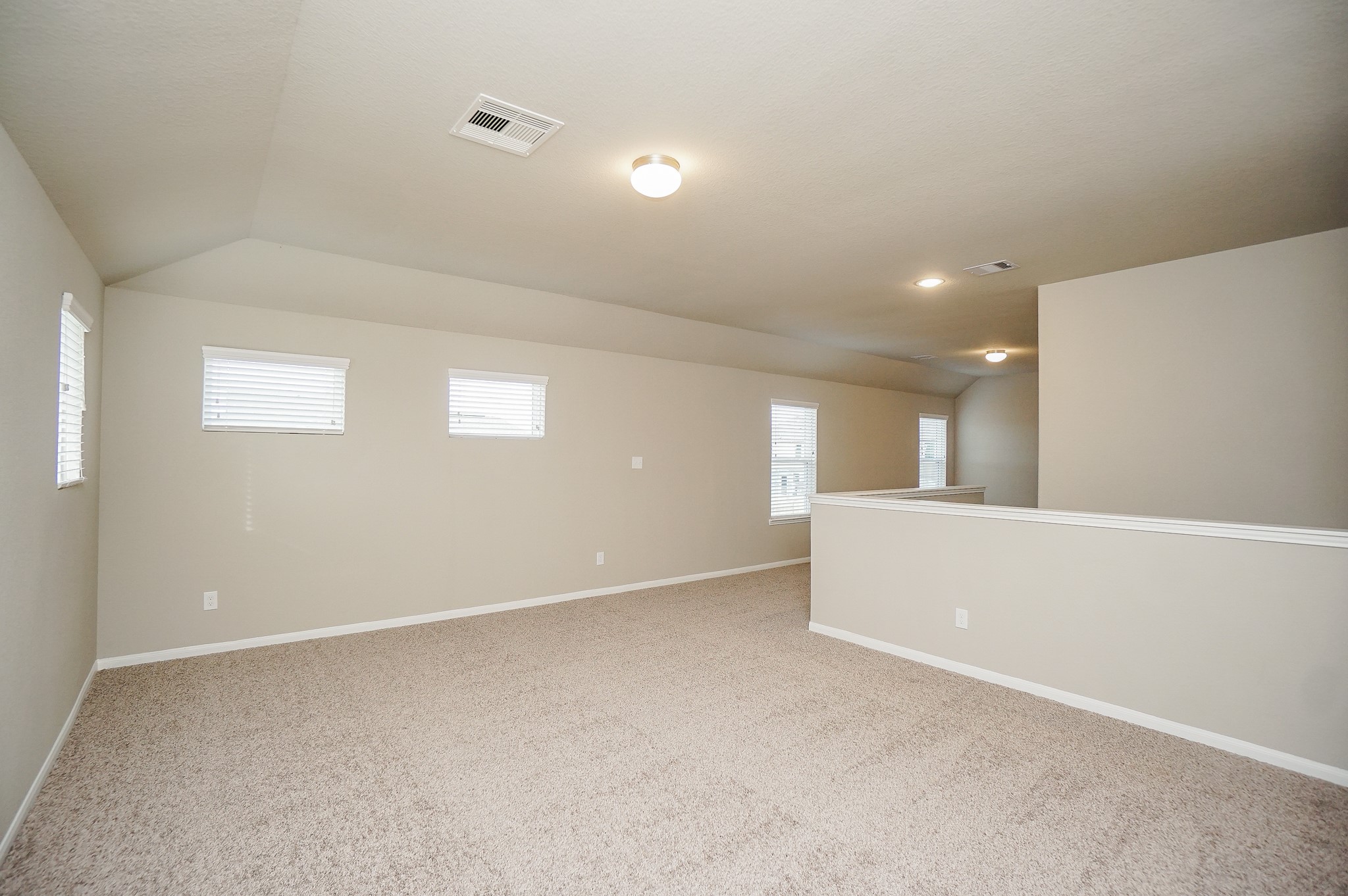 5463 Grand View Drive Fulshear, TX 77423 - Photo 30 of 32 a view of an empty room with wooden floor