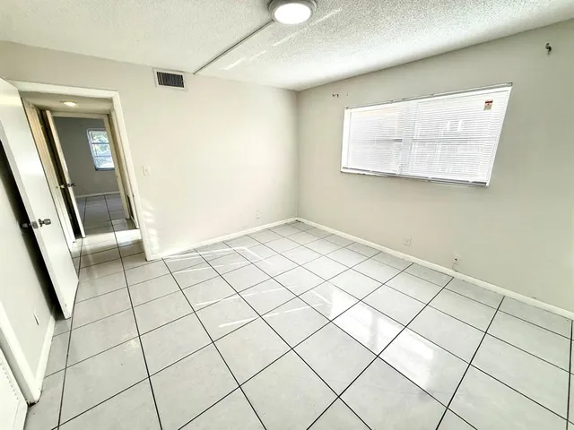 a spacious bathroom with a sink toilet and shower