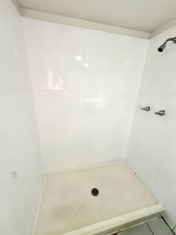 a large white tub sitting in a bathroom