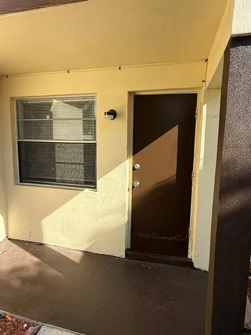 a front view of a house with parking space