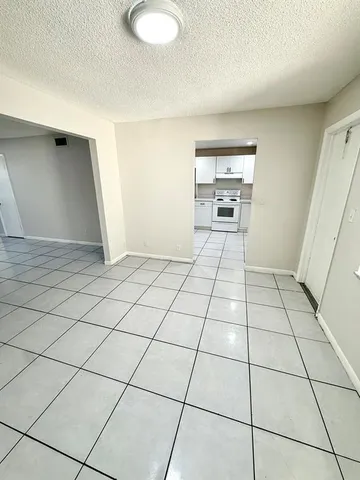 a view of a livingroom with an empty space and a sink