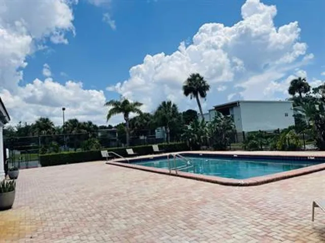 a view of outdoor space yard and swimming pool