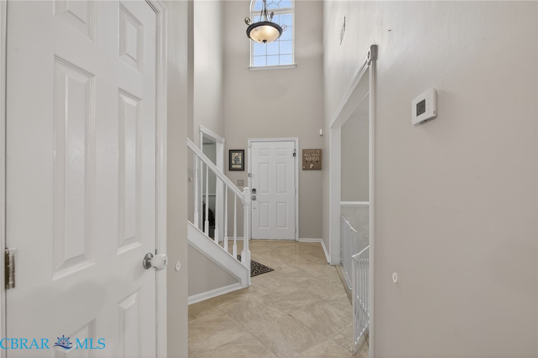 116 Old Field Road Williamsburg, VA 23188 - Photo 4 of 27 Entryway featuring a high ceiling and stairs