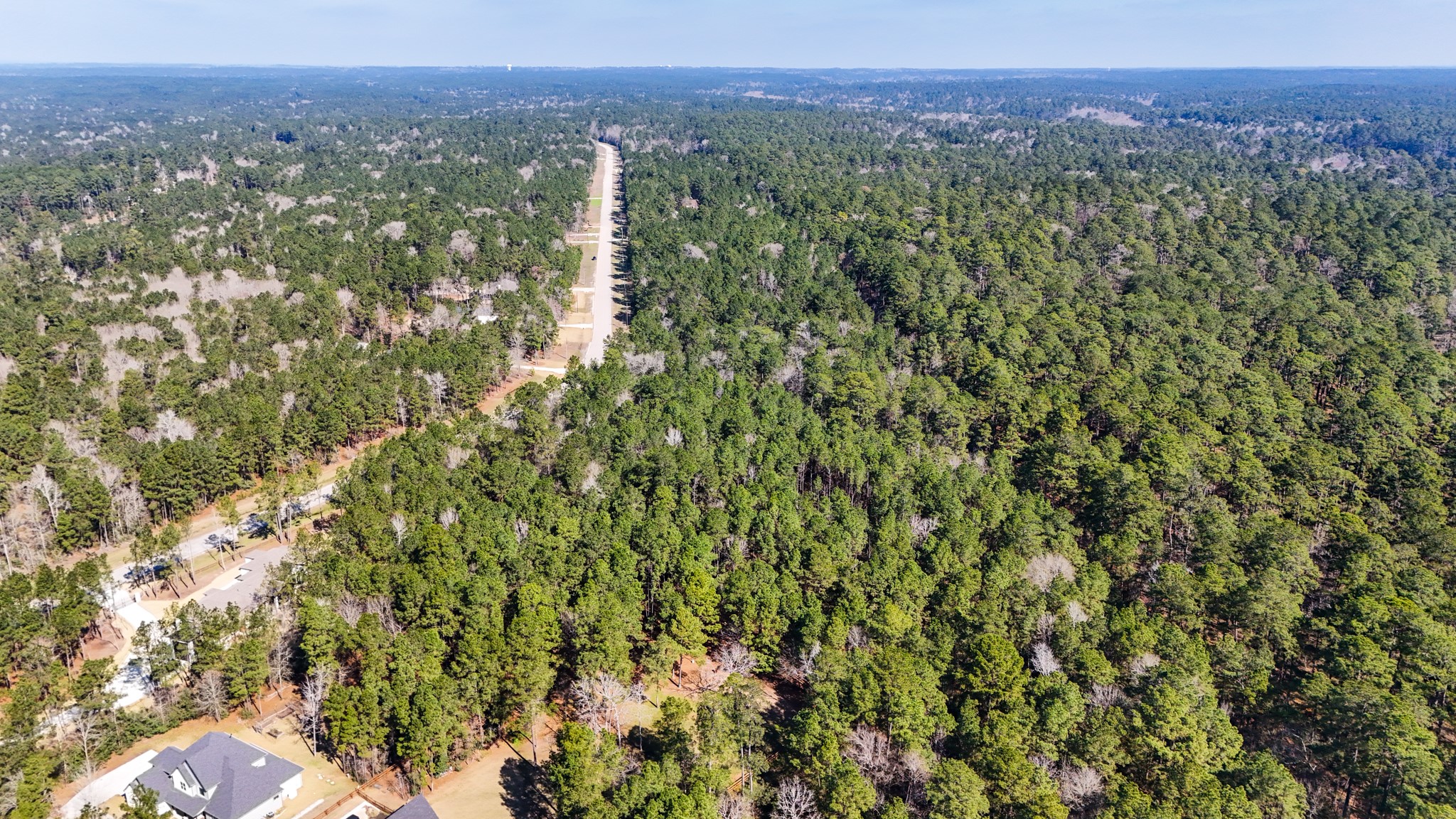 5-23-14 Rim Rock Road Huntsville, TX 77340 - Photo 17 of 45 Experience the serene ambiance and picturesque setting of this wooded lot from above.