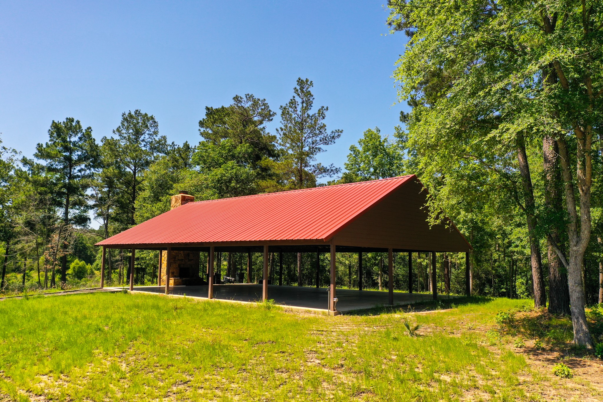 5-23-14 Rim Rock Road Huntsville, TX 77340 - Photo 31 of 45 Enjoy the covered pavilion at Dedication Trail Park, an ideal spot for gatherings and relaxation just minutes from your property in Texas Grand Ranch.