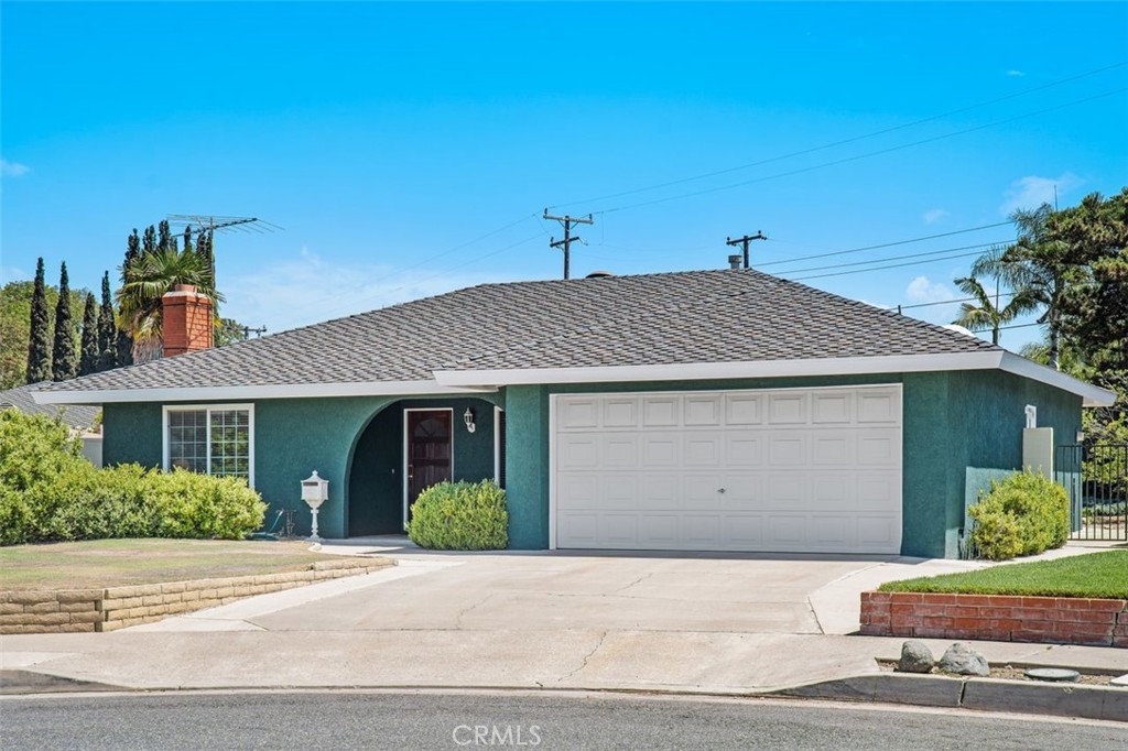 a front view of a house with a garage