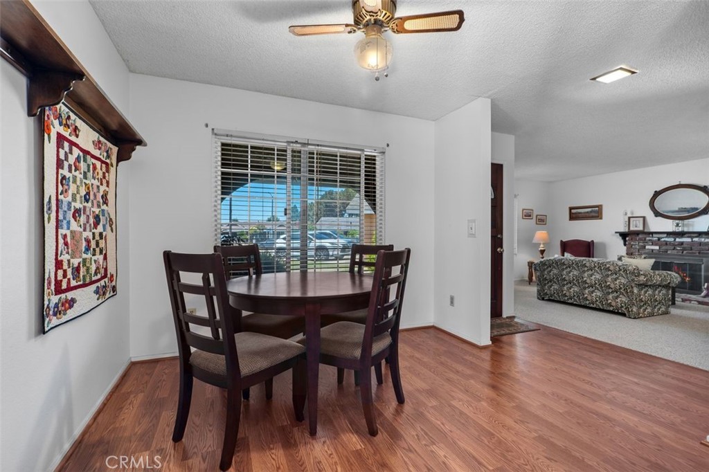 2233 East Everett Place Orange, CA 92867 - Photo 13 of 40 a view of a dining room with furniture and wooden floor