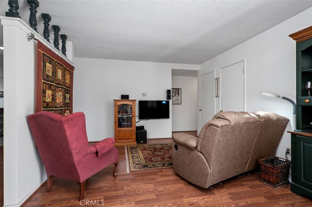 2233 East Everett Place Orange, CA 92867 - Photo 16 of 40 a living room with furniture and a flat screen tv