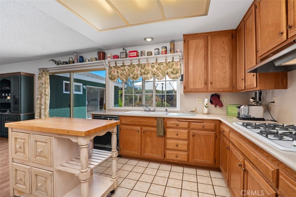 2233 East Everett Place Orange, CA 92867 - Photo 22 of 40 a kitchen that has a sink and a stove