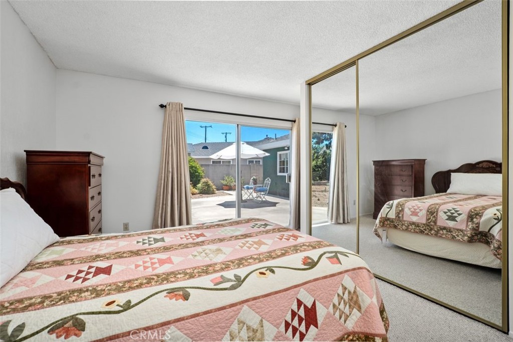 2233 East Everett Place Orange, CA 92867 - Photo 24 of 40 a bedroom with a large bed and a large window